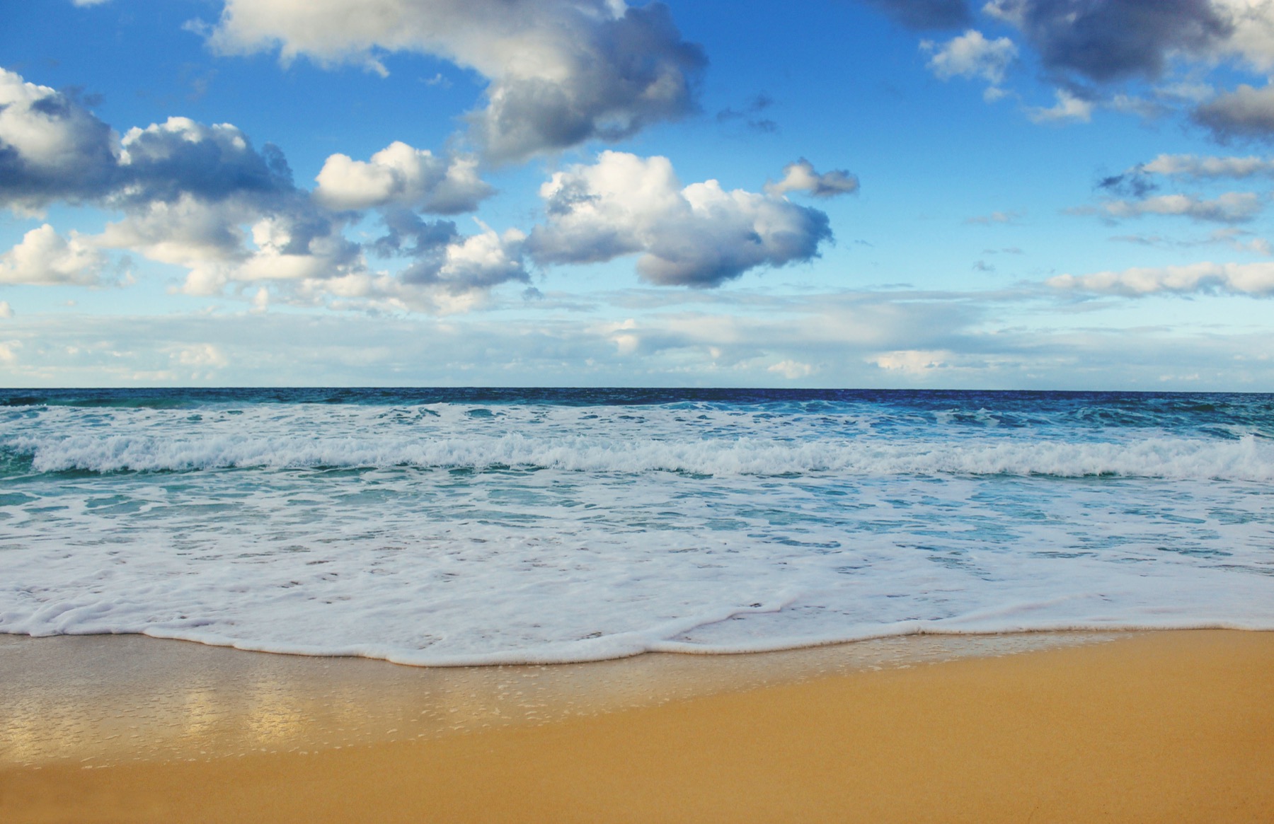 Clouds and breaking waves along the coast at Marsa Matruh